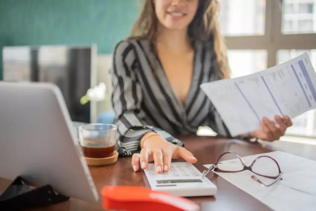 Young woman working on taxes.