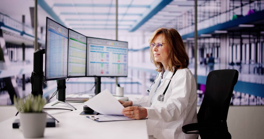 Doctor at a healthcare practice on the computer doing taxes
