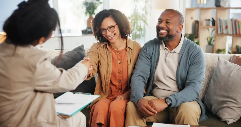 An older couple talking to a CPA about estate planning.